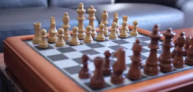 A chess board with the chess pieces in start position