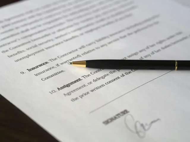 A signed document with a pen sitting on top of it